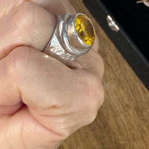 Radiant Silver Ring with Golden Yellow Gemstone